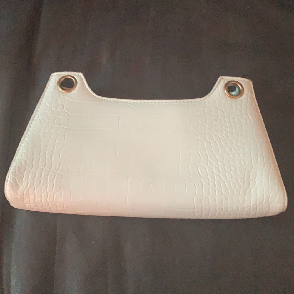 White animal print purse with dark brown in inside . Hope you enjoy💋